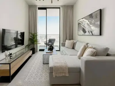 a living room with a couch and a tv at Modern 1BR Apt in Binghatti Gardenia with Pool & Gym! in Dubai