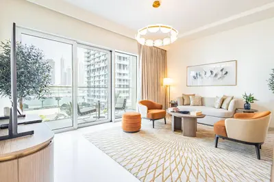 a living room with a couch and a table at Elegant 2BR, Grand Bleu, Coastal Elegance in Dubai