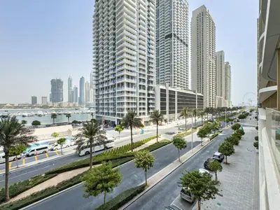 a street in a city with tall buildings at Elegant 2BR, Grand Bleu, Coastal Elegance in Dubai
