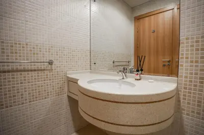 a bathroom with a sink and a mirror at Stylish 1BHK in Sulafa Tower at Dubai Marina in Dubai