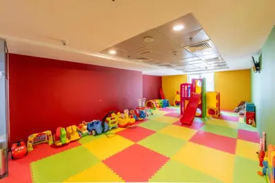 a room with a play area with toys on the floor at Stylish 1BHK in Sulafa Tower at Dubai Marina in Dubai