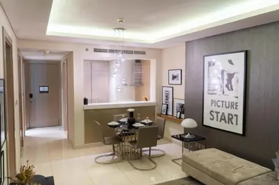 a living room with a table and a couch at Luxury 1BHK in Damac Paramount Towers, Business Bay in Dubai