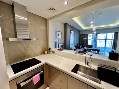 a kitchen with a sink and a counter top at Luxury 1BHK in Damac Paramount Towers, Business Bay in Dubai
