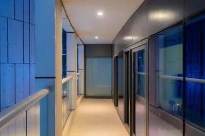 a hallway of a building with glass doors at Luxury 1BHK in Damac Paramount Towers, Business Bay in Dubai