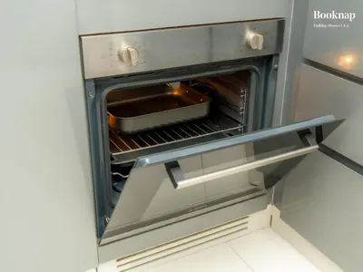 an oven with a pan inside of it at Luxury 1BHK Apartment at DAMAC Prive A, Business Bay in Dubai