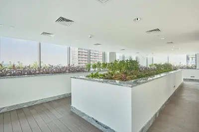 a large room with plants on the ceilings at STAY BY LATINEM Luxury 1BR Holiday Home CB 2001 Near Burj Khalifa in Dubai