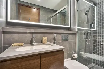 a bathroom with a sink and a shower at STAY BY LATINEM Luxury 1BR Holiday Home CB 2001 Near Burj Khalifa in Dubai
