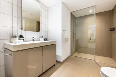 a bathroom with a sink and a shower at Contemporary 1Bedroom Escape in Eaton Place in Dubai