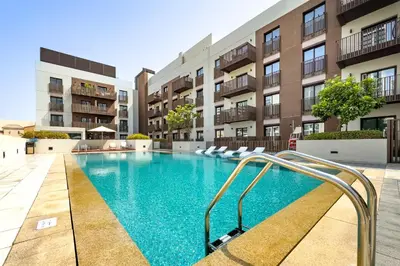 an image of a swimming pool in a apartment building at Contemporary 1Bedroom Escape in Eaton Place in Dubai