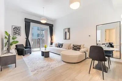 a living room with a couch and a table at Contemporary 1Bedroom Escape in Eaton Place in Dubai