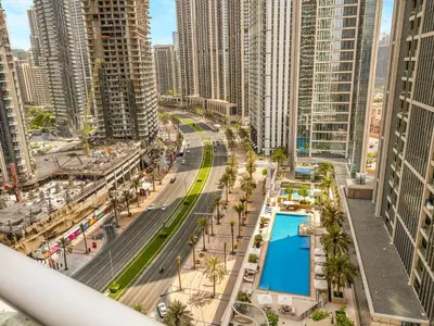 an aerial view of a city with a pool at Luxury Stay in Downtown-Steps to Burj & Dubai Mall in Dubai