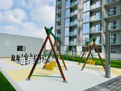 a playground in front of a building at One Park Avenue, Sobha Hartland 3 BR in Dubai