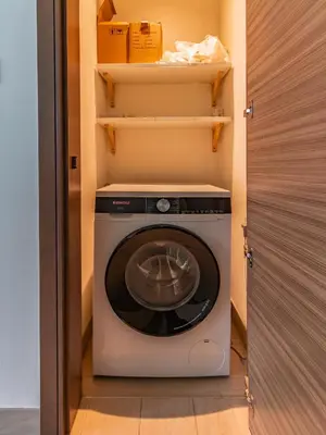 a washer and dryer in a small room at One Park Avenue, Sobha Hartland 3 BR in Dubai