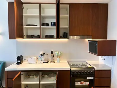 a kitchen with a stove and a counter top at NYE Firework View - Beachfront Residence - Sea View in Dubai