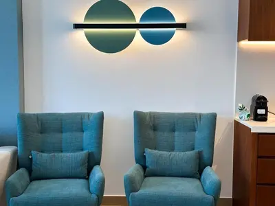 two blue chairs sitting next to each other in a room at NYE Firework View - Beachfront Residence - Sea View in Dubai
