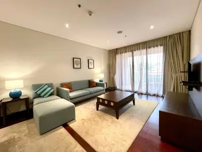 a living room with a couch and a table at Specious 1 Br In Royal Amwaj Residences South in Dubai