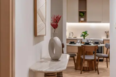 a vase sitting on a table in a living room at Creek Harbour Serenity with Burj Khalifa Glimpse in Dubai