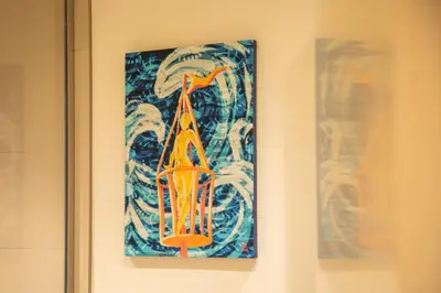 a painting hanging on a wall in a room at Stylish Beachfront Creek Escape in Dubai
