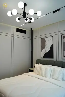 a bedroom with a white bed with a ceiling fan at TOP VIEW Luxury 2 bedrooms in Dubai only families in Dubai