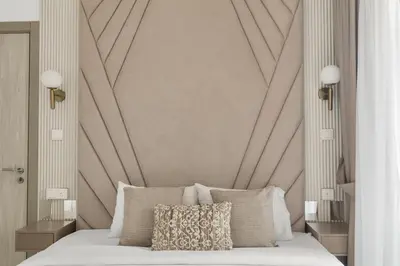 a bedroom with a bed with a large wall at Zarela Luxe with River Views in Dubai