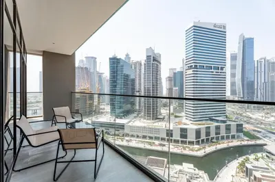 a balcony with a view of a city at GuestReady - 1BR l Canal View | Near Dubai Mall in Dubai