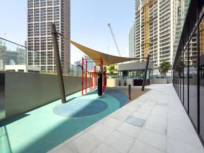 a playground in the middle of a city with tall buildings at GuestReady - 1BR l Canal View | Near Dubai Mall in Dubai