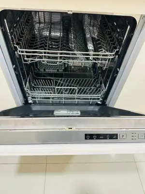 a dishwasher with its door open with a rack inside at Plush & Modern 2BR Luxury stay with picturesque Rooftop 64th floor in Dubai