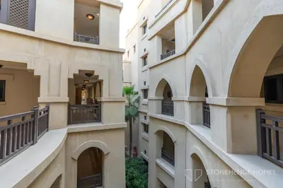 an alley between two buildings with balconies at Chic 1BR Apartment in Downtown Dubai Steps Away from Burj Khalifa & Dubai Mall in Dubai