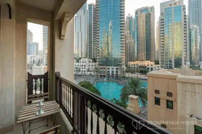 a balcony with a view of a city at Chic 1BR Apartment in Downtown Dubai Steps Away from Burj Khalifa & Dubai Mall in Dubai