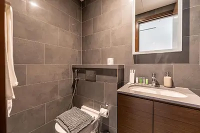a bathroom with a sink and a mirror at HAVN - 2 Bedroom Luxe Stay at The Crest, Sobha in Dubai