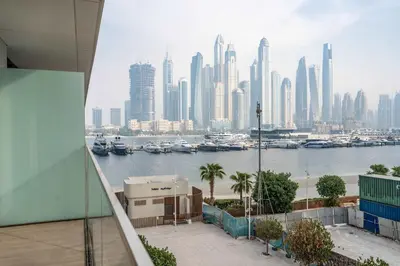 a view of a city skyline with boats in the water at Luxury 1 Bedroom in Emaar Beach Front - Dubai Marina - Private Beach in Dubai