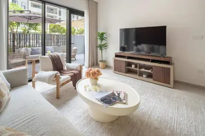 a living room with a tv and a couch at Frank Porter - Bayshore at Creek Beach Building 4 in Dubai