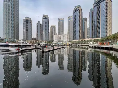 a city skyline with tall buildings and a body of water at Frank Porter - Bayshore at Creek Beach Building 4 in Dubai