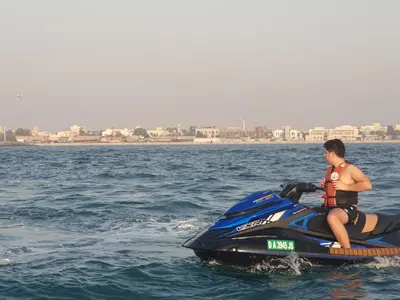 a man sitting on a jet ski in the water at A one sports jetski rental in Dubai