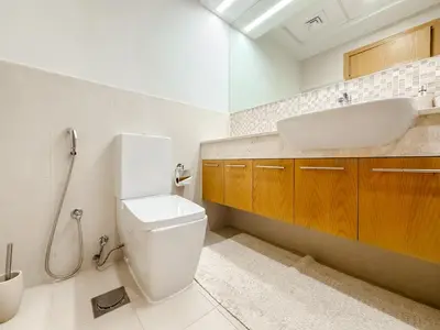 a bathroom with a toilet and a sink at Zinnia Luxury 2BHK Bellevue Burj Khalifa View in Dubai