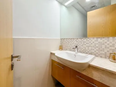 a bathroom with a sink and a mirror at Zinnia Luxury 2BHK Bellevue Burj Khalifa View in Dubai