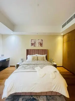 a bedroom with a large bed with white sheets at Luxurious 1 Bedroom Apartment in Heart of Dubai in Dubai