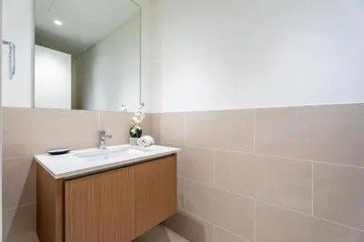 a bathroom with a sink and a mirror at GuestReady - Canal View | 3 Bed | Lagoon Stay in Dubai