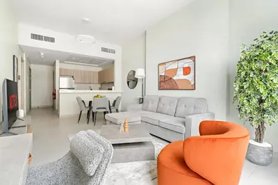 a living room with a couch and chairs at VayK - Prestigious 1BR Apartment in Dubai Hills Estate in Dubai