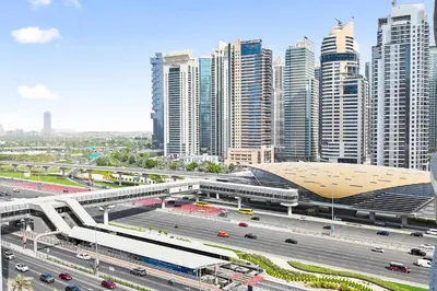 a city with a highway and buildings and traffic at Luxury 2BR Marina View-walking distance to JBR beach, marina mall & metro in Dubai
