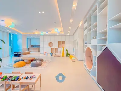 a large living room with tables and chairs at Next to Burj Khalifa & Dubai Mall Luxury 2BR Grande Signature - Like Home in Dubai