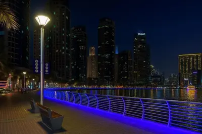 a city skyline at night with a street light at AquaVista Ensuite Room - Lakeview in Dubai