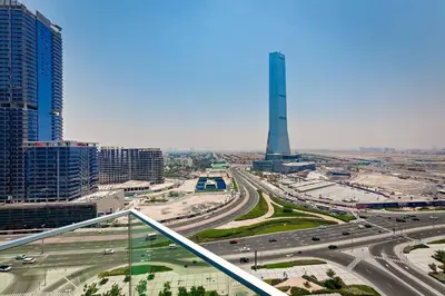 a view of a city with a tower in the background at Elegant 1BR Apartment Me Do Re Tower in JLT in Dubai