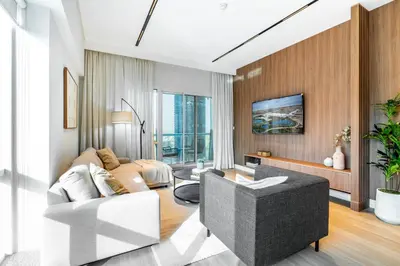 a living room with a couch and a table at Luxury Lakeview Escape in Dubai