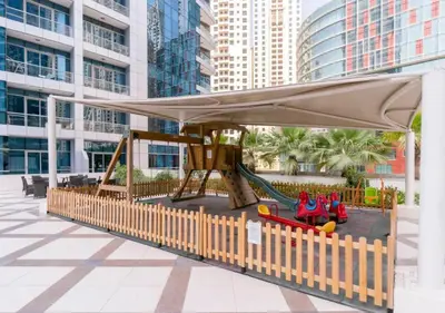a playground with a canopy and slide in a building at Stylish Studio Apartment with a Balcony Offering Sophistication, Spectacular Views & Beachside Living! in Dubai