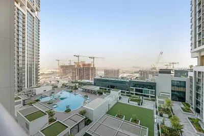 an aerial view of a building with a swimming pool at Classy 2BR Dubai Getaway Near Downtown in Dubai