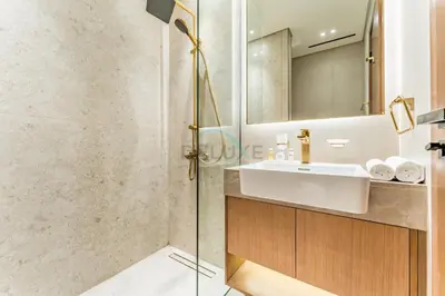 a bathroom with a sink and a mirror at Minutes from Circle Mall, Grocery Stores & Bus Stop 2BR with Mini Private Pool on Balcony, Binghatti Tulip, Jumeirah Village Circle by Deluxe Holiday Homes in Dubai