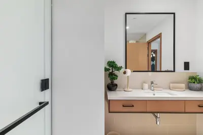 a bathroom with a sink and a mirror at Novity Signature Homes in Dubai