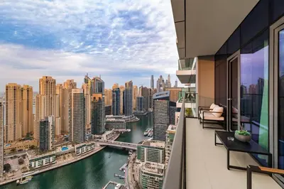 a balcony with a view of a river and buildings at Novity Signature Homes in Dubai