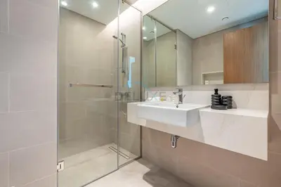 a bathroom with a sink and a shower at Spacious 3BR Living, Walking Distance to Dubai Water Canal and Park, Near Safa Park Marine Transport Station, Canal Front 9B, Al Wasl by Deluxe Holiday Homes in Dubai